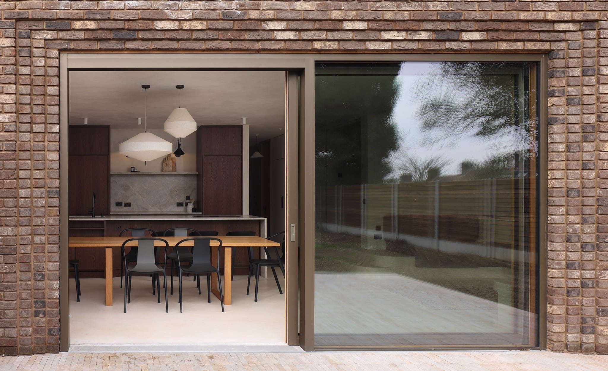 Large timber-aluminium sliding doors for a London extension