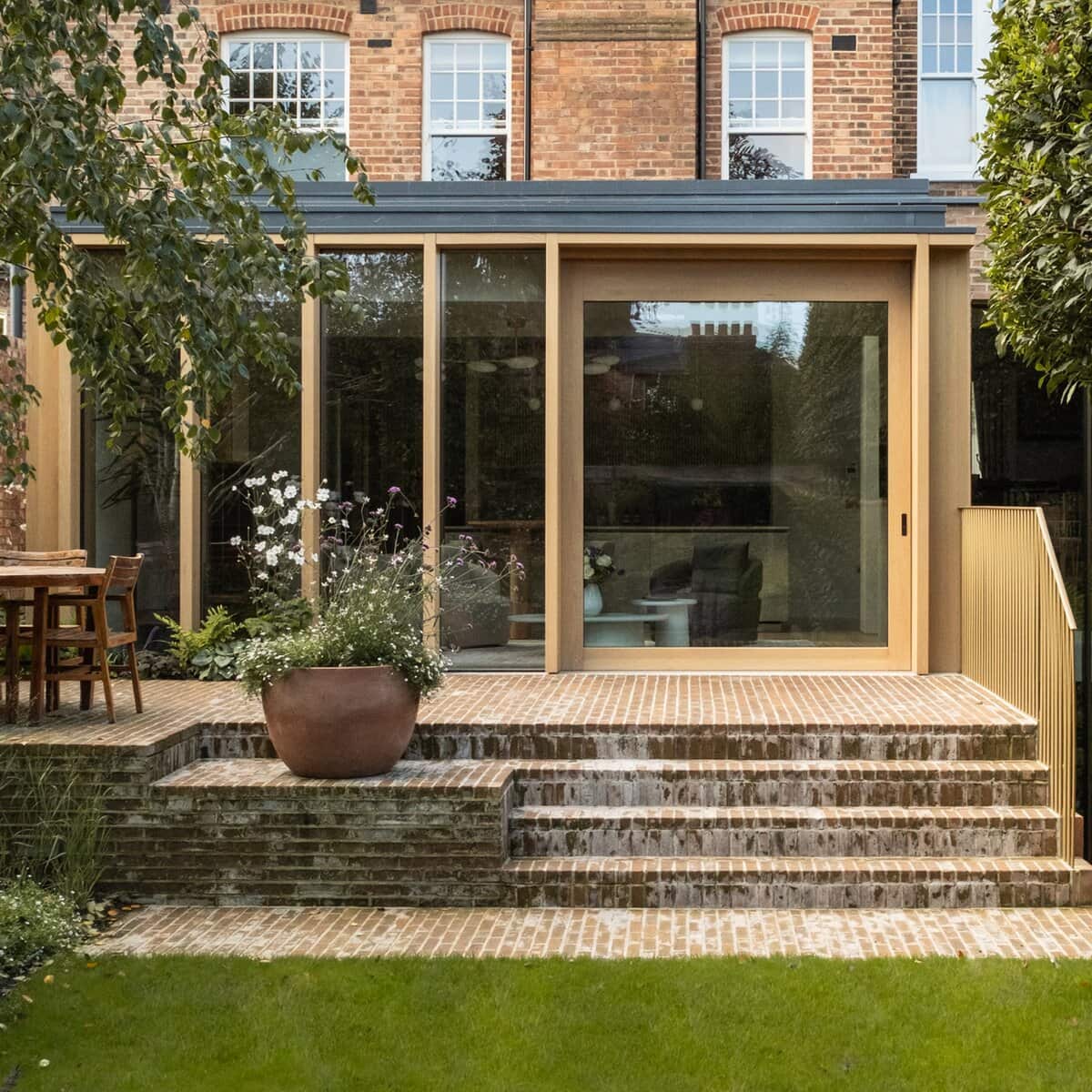 An outside view on the vantage modern oak sliding door used for Garden Pavilion project