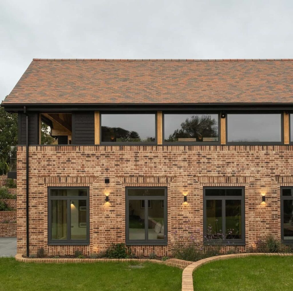 Composite oak windows and sliding door at Meadow House