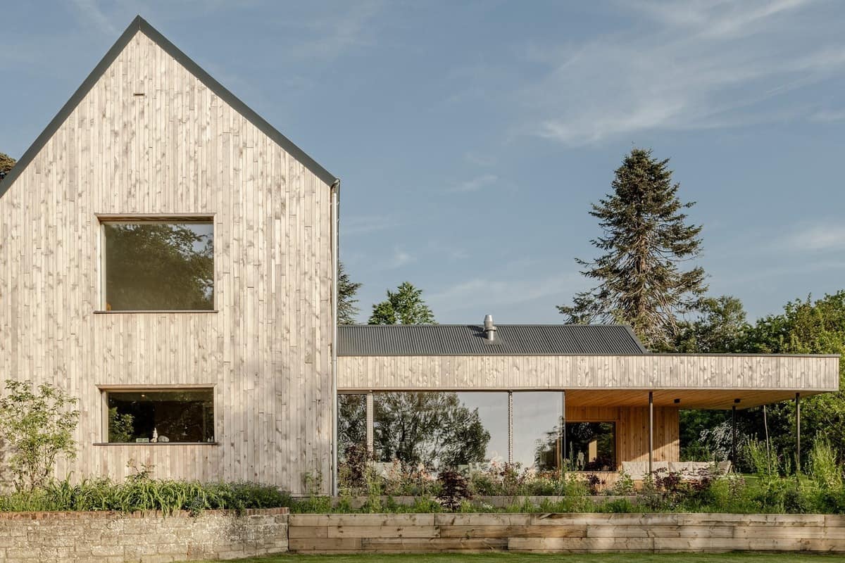 Modern Passivhaus windows across the timber-clad Passive Orchard home