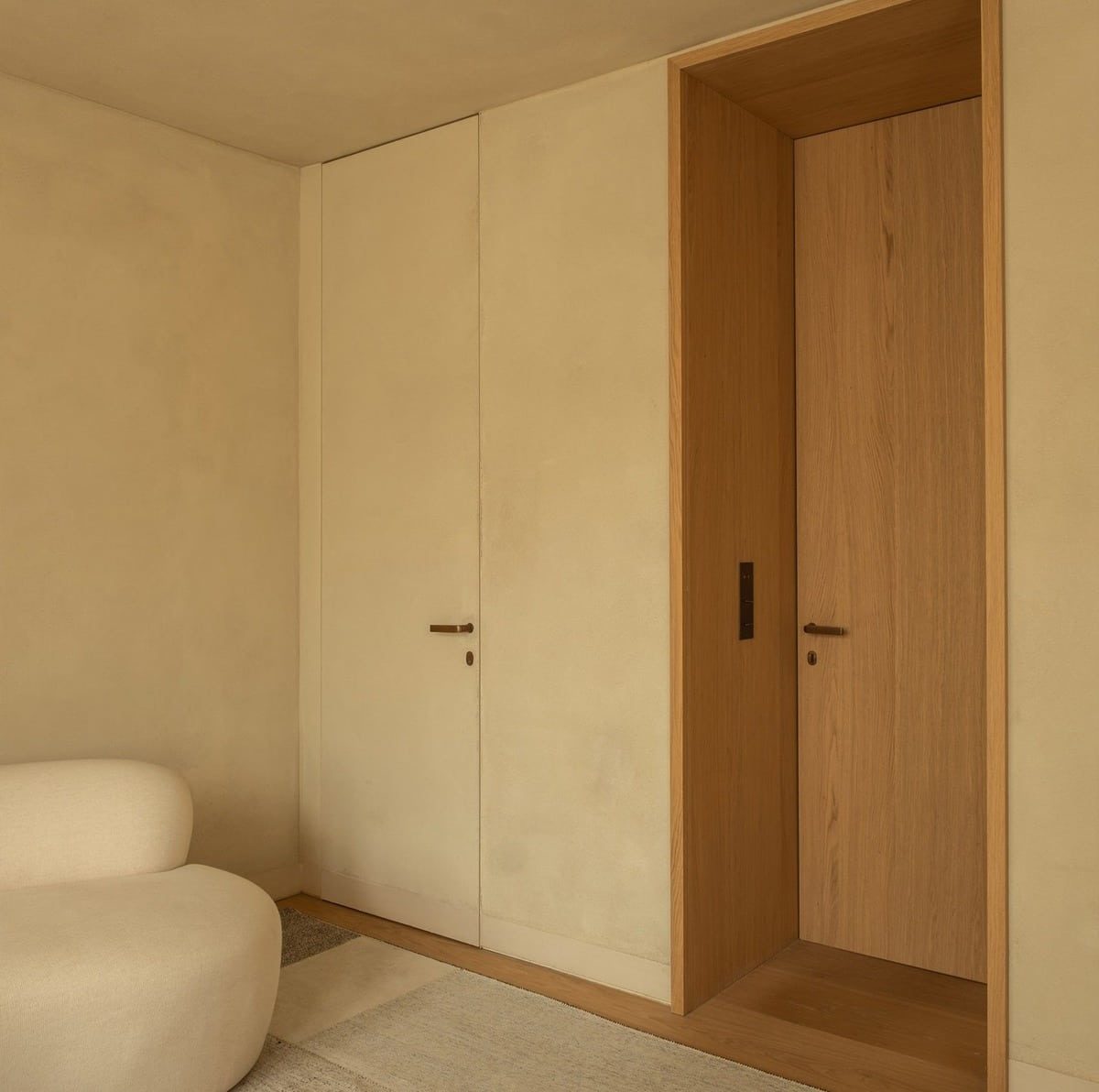 Invisio flush internal door beside a bespoke oak doorway at The Still House