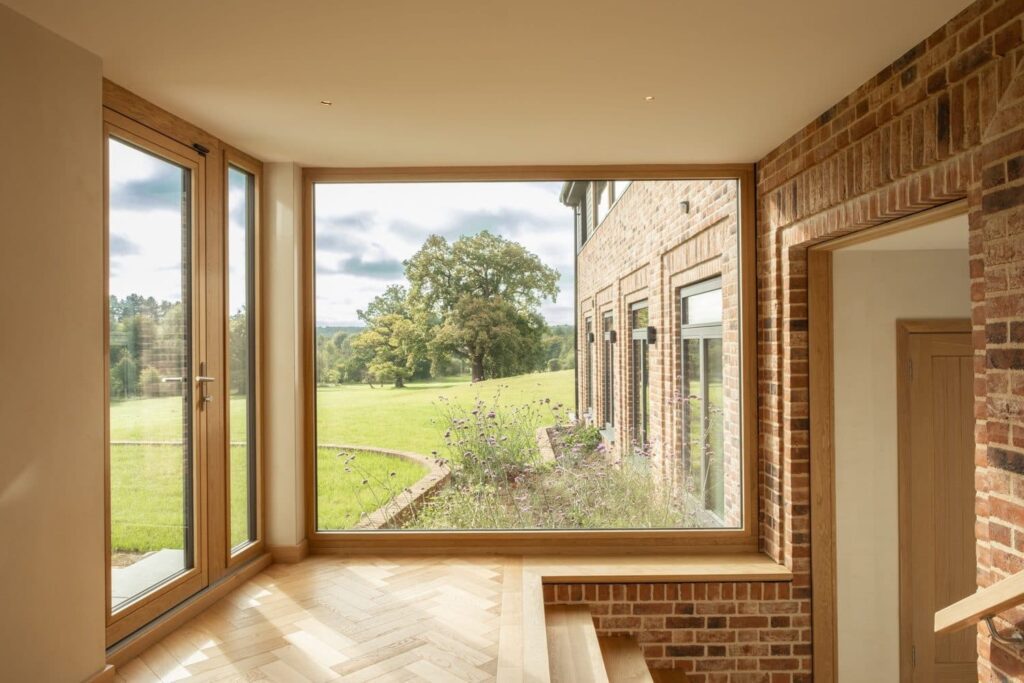 Dark aluminium-clad windows with timber interior on a contemporary home